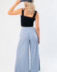 Back view of Free People Soft Chambray Wide-Leg Lounge Pants showing elastic waistband and soft drape, perfect for everyday loungewear.