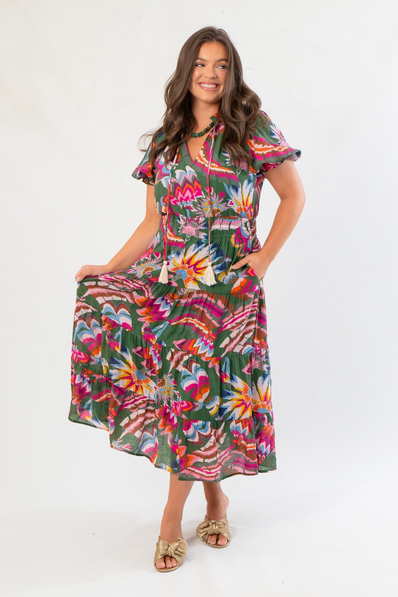THML Printed Puff Sleeve Tiered Maxi Dress in green with vibrant floral print, featuring puff sleeves and a flowy tiered midi silhouette.
