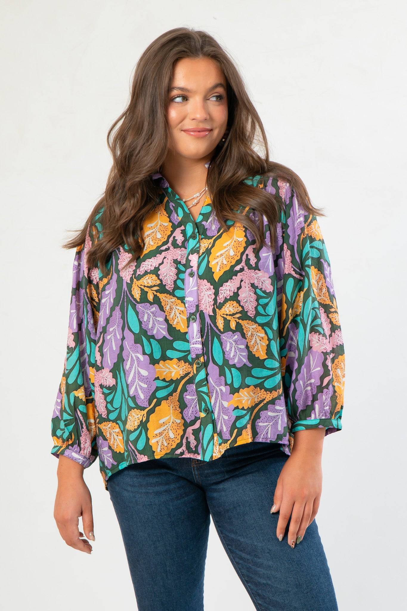 Next Chapter Hunter Green Floral Button Down Blouse with balloon sleeves and vibrant fall leaf print in purple, teal, and mustard tones.
