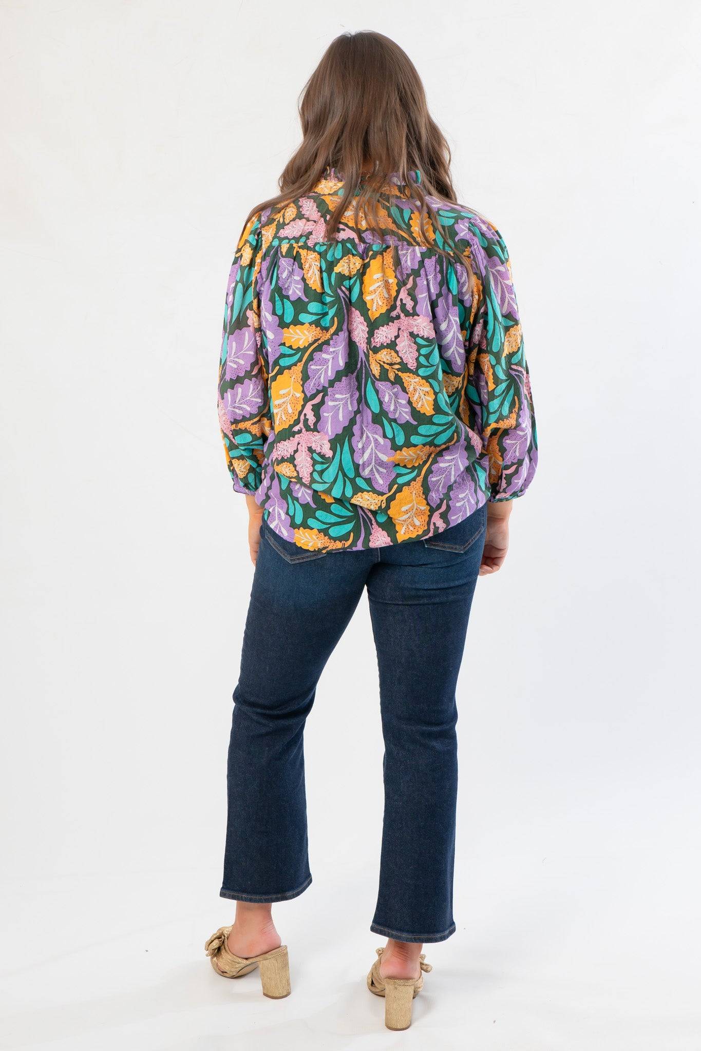 Back view of Next Chapter Hunter Green Floral Button Down Blouse showing flowy silhouette and all-over fall leaf print.