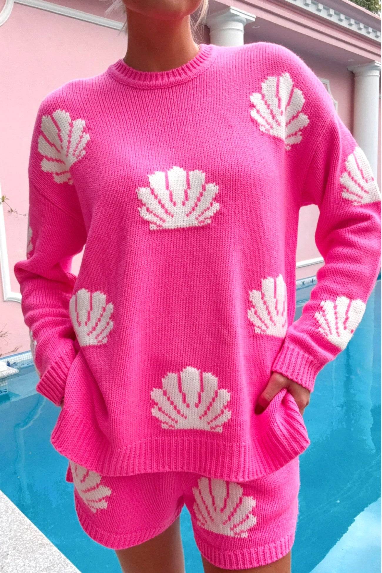 Show Me Your Mumu Hot Pink Shell Go To Sweater featuring a cozy crewneck design with white shell knit patterns. Perfect for layering on vacation or casual outings.