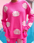 Show Me Your Mumu Hot Pink Shell Go To Sweater featuring a cozy crewneck design with white shell knit patterns. Perfect for layering on vacation or casual outings.
