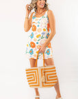 Spring Multi-Floral Mini Dress with vibrant floral print, sleeveless design, and pockets. Perfect for Easter, vacations, and warm-weather outings.