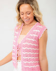 Close-up of the Sweet As Can Be Pink Crochet Open Front Tie Vest, showcasing intricate crochet patterns and a flattering tie-front closure.