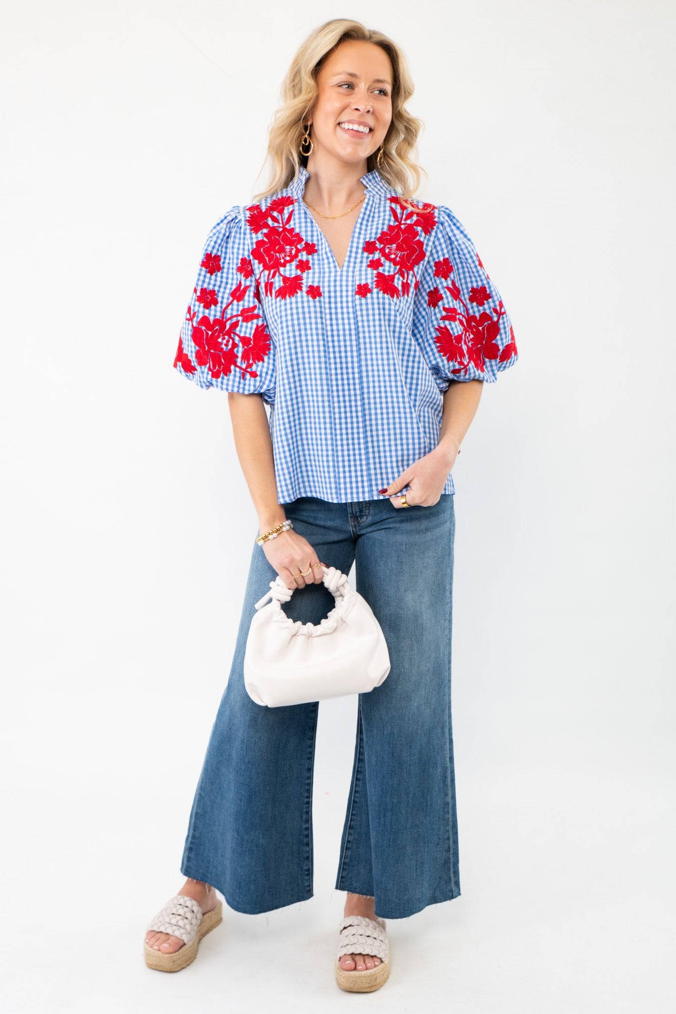 Full outfit featuring THML Blue Gingham Embroidered Top LM styled with wide-leg denim jeans, a white ruched handbag, and woven platform sandals.