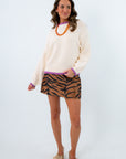 neutral sweater with a vibrant purple pop for game day looks, vertical stitch detailed sweater for chic and comfy fall vibes