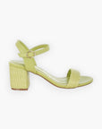 Side view of green raffia block heel sandals featuring a woven raffia heel and sleek ankle strap for a fresh and stylish summer look.