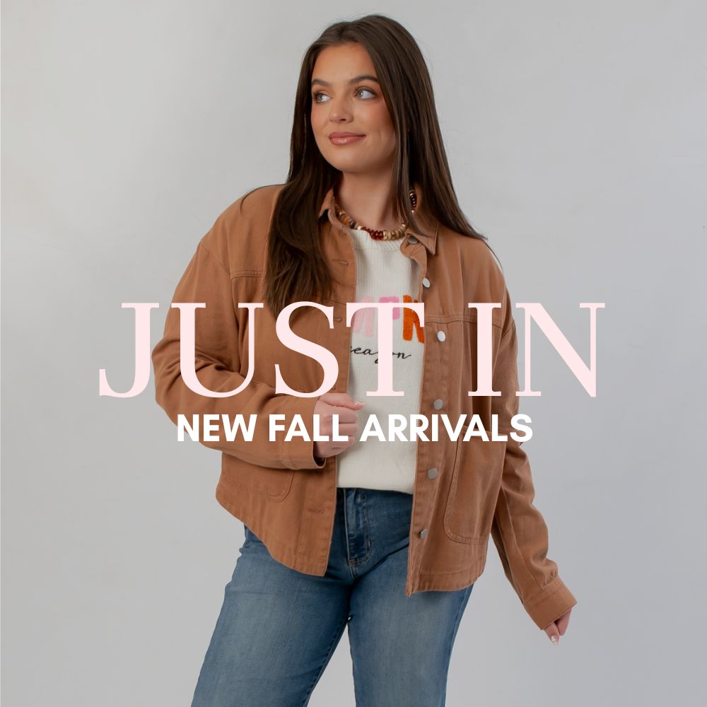 Group of friends celebrating in fun and colorful fall boutique finds and colorful fall fashion styles.