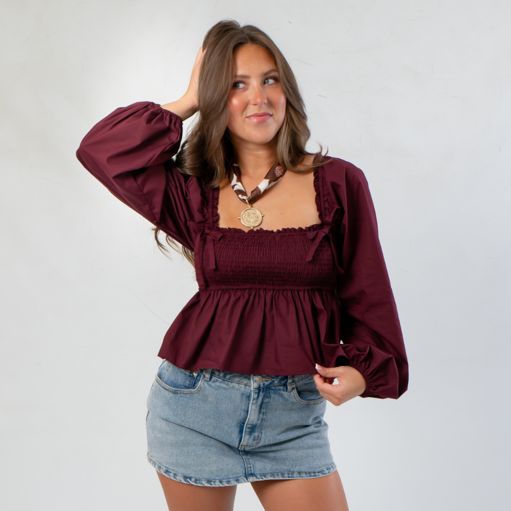 Romantic autumn vibes with feminine gameday style by the beach—garnet gameday outfits, neutral accents, and stylish tailgate looks