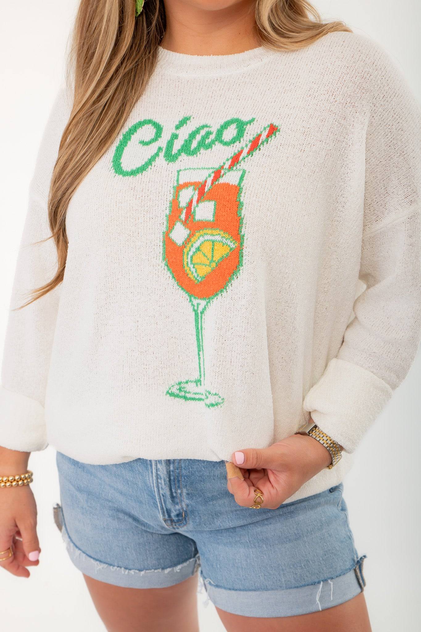 Close-up of Show Me Your Mumu Ciao Cocktail Woodsy Sweater featuring vibrant cocktail glass graphic and textured knit fabric.