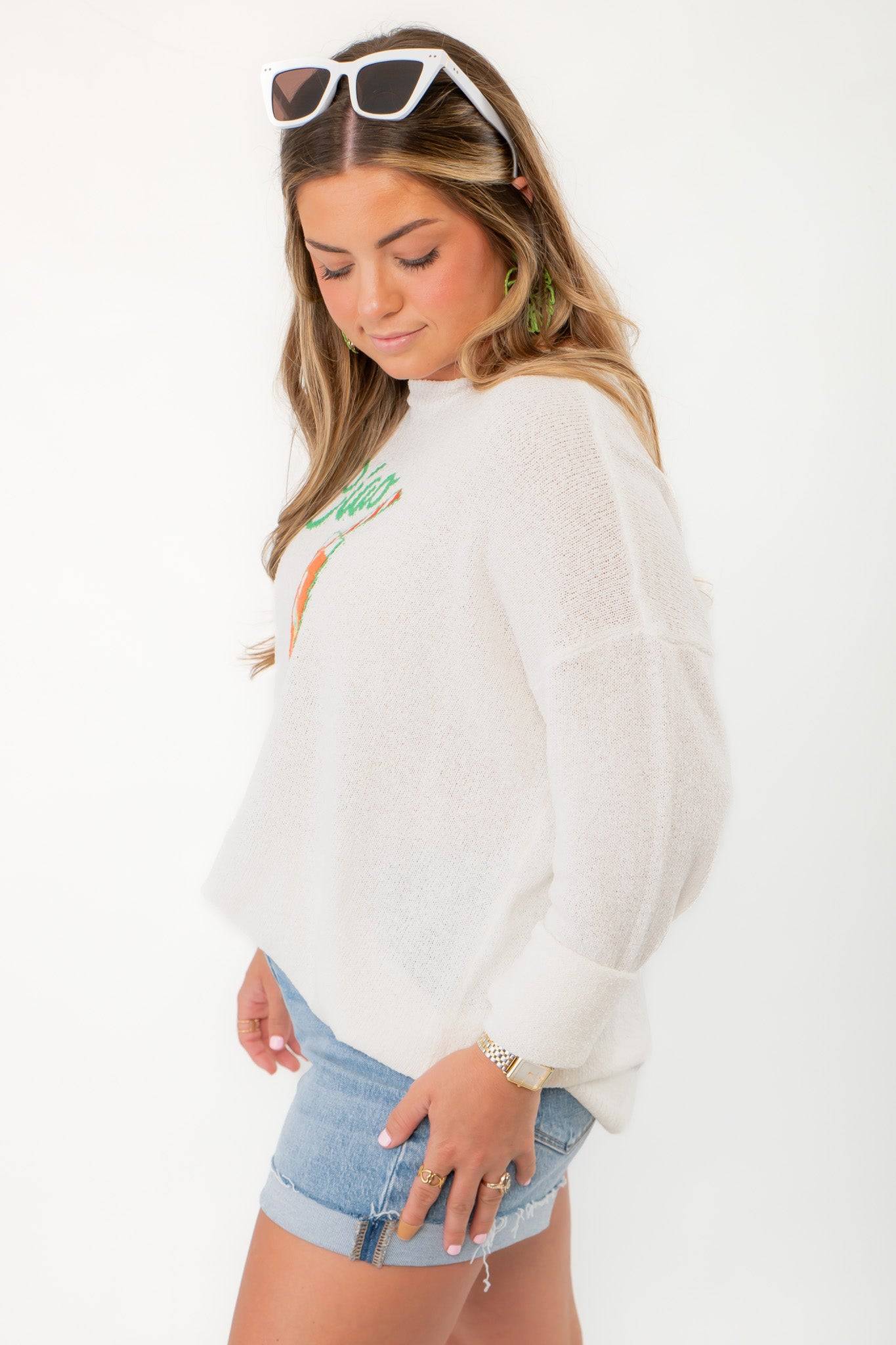 Side view of Show Me Your Mumu Ciao Cocktail Woodsy Sweater highlighting relaxed fit and lightweight knit texture.