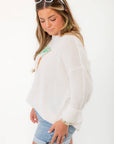 Side view of Show Me Your Mumu Ciao Cocktail Woodsy Sweater highlighting relaxed fit and lightweight knit texture.