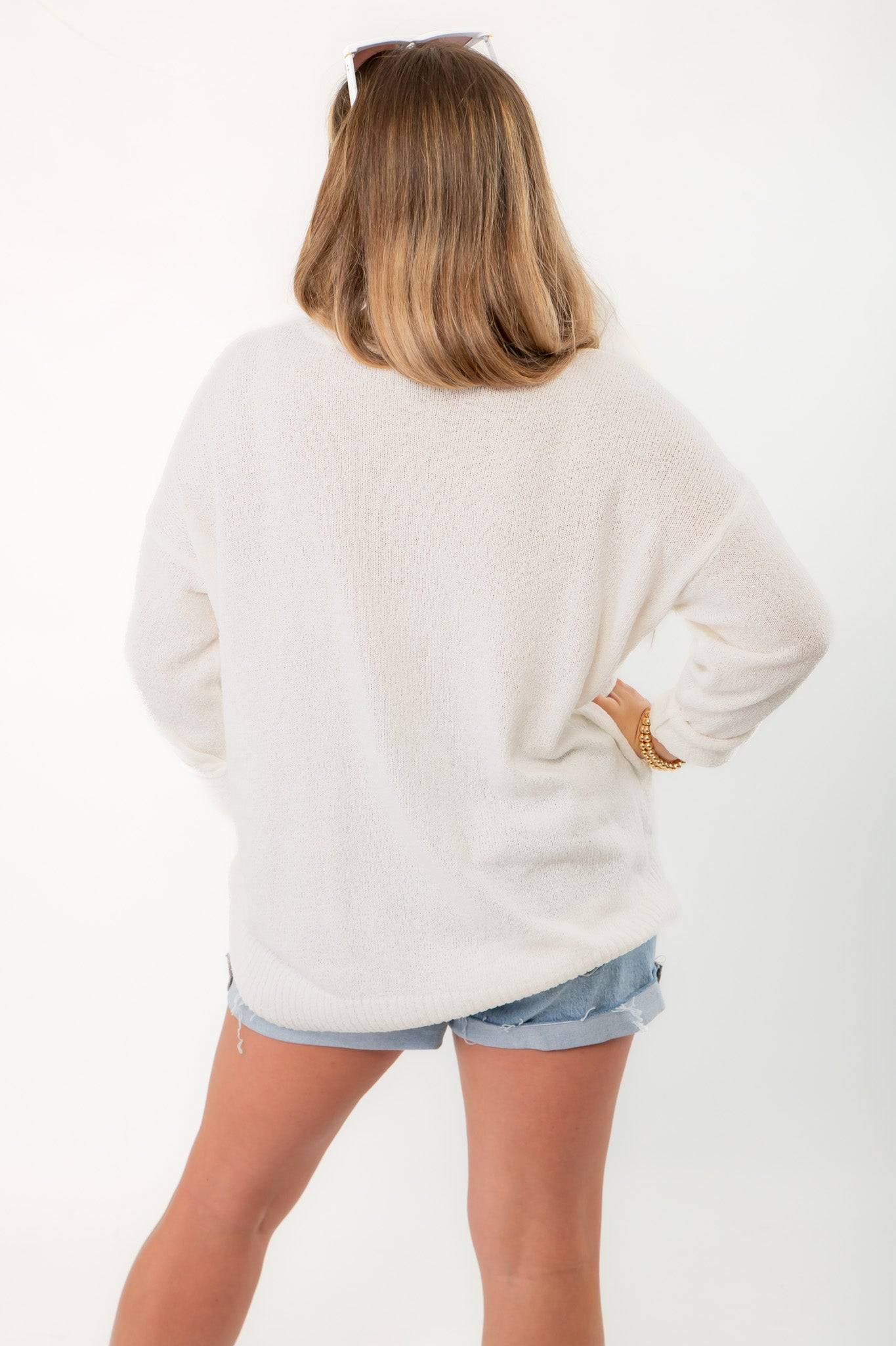 Back view of Show Me Your Mumu Ciao Cocktail Woodsy Sweater showing loose silhouette and soft knit material for casual wear.