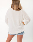 Back view of Show Me Your Mumu Ciao Cocktail Woodsy Sweater showing loose silhouette and soft knit material for casual wear.