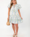 Enchanting Blue Hydrangea Flutter Sleeve Mini Dress for Summer featuring a tiered skirt and floral print, styled with neutral accessories.