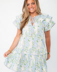 Blue Hydrangea Flutter Sleeve Mini Dress with ruffled sleeves and tie neckline, perfect for baby showers or casual summer outings.