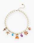Full view of Colorful Sea Life Charm Pearl Necklace arranged in a circle, adorned with playful ocean-themed charms on pearl beads.