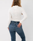 Back view of Free People Clean Ivory Brunch Girl Zip Up - We the Free Knit Top highlighting ribbed knit pattern, collared back, and tailored fit.