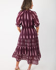 Back view of THML Burgundy & Pink Pattern Maxi Dress with smocked waist and feminine silhouette, great for holiday or special occasion styling.