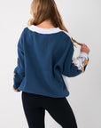 Back view of the Wrapped in Stars Grey & Navy Star Sweatshirt highlighting the navy back panel and contrast sleeve design.