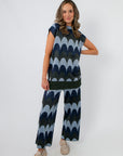 Retro Wave Metallic Knit Cropped Pant in blue wave pattern, styled with matching top for a trendy lounge or casual look.