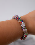 Colorful Seed Bead Bracelet – Lightweight stretchy bracelet with multicolor beads shown worn on wrist, ideal for stacking and daily wear.