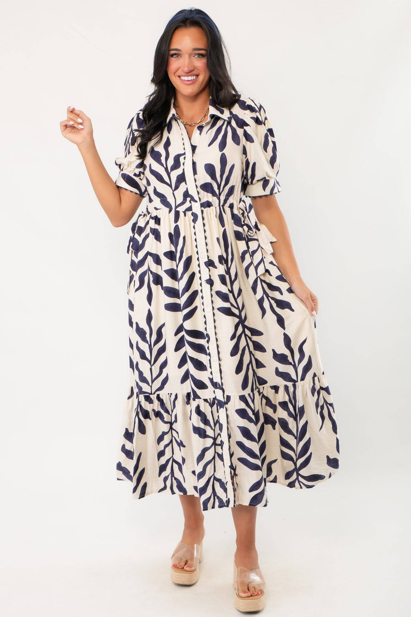 Harmony Navy & Cream Puff Sleeve Collared Midi Dress featuring short puff sleeves, navy botanical print, and a relaxed summer silhouette.