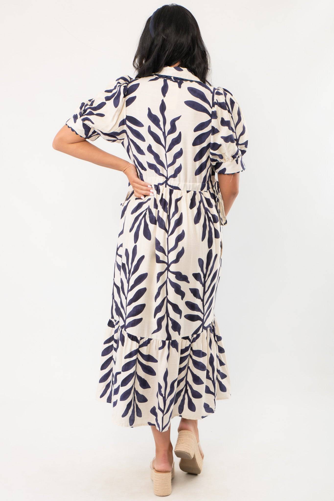 Back view of Harmony Navy & Cream Puff Sleeve Collared Midi Dress showing gathered waist, puff sleeves, and tiered hem for a breezy summer look.