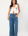Versatile Dark Wash Denim Wide Leg Drawstring Pants styled with a sleeveless crop top, featuring a relaxed fit and elastic waistband for comfort.