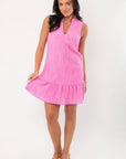 Front view of THML Pink Textured Sleeveless Dress with ruffled hem and relaxed fit, perfect for warm-weather occasions and vacations.