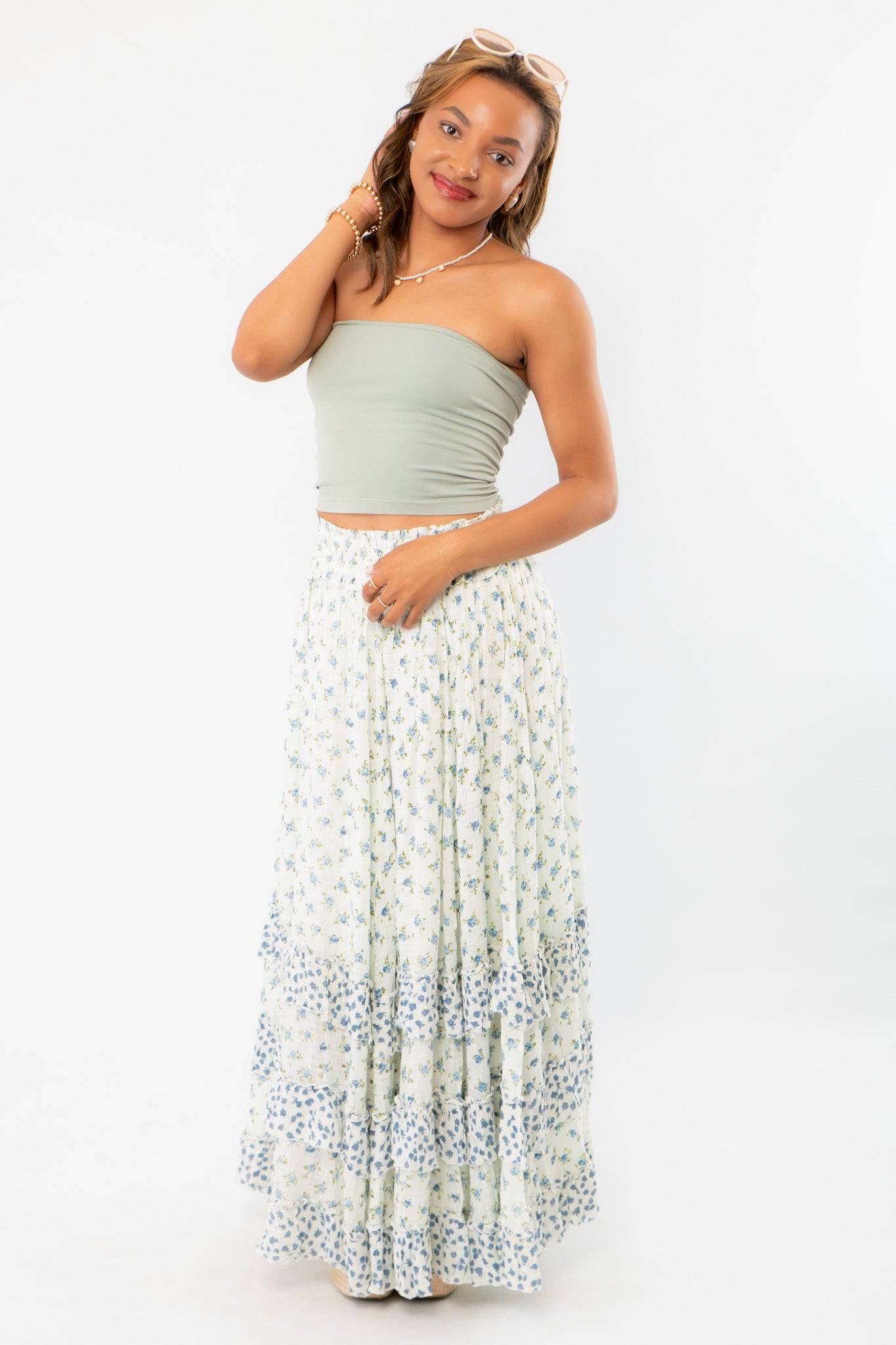 Free People Ivory Combo One Brynn Printed Maxi Skirt styled with a sage green tube top, showcasing boho chic elegance with tiered ruffles.