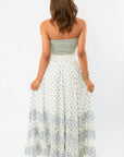 Back view of Free People Ivory Combo One Brynn Printed Maxi Skirt, showcasing the tiered ruffle details and breezy boho chic aesthetic.