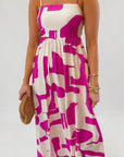 Close-up of Meet Me in Santorini Fuchsia Wave Maxi Dress showing square neckline, fitted bodice, and vibrant fuchsia wave pattern.
