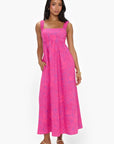 Model wearing the Show Me Your Mumu Pink Shells Fling Midi Dress, a flirty and fun summer outfit with pockets and a relaxed fit.