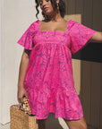 Show Me Your Mumu Pink Shells Erin Mini Dress with flutter sleeves and square neckline, perfect for summer resort wear.