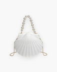 Shore Thing Clutch – shell-inspired white evening bag with pearl handle and gold chain, ideal for summer outfits and beach-themed events.