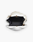 Interior of Shore Thing Clutch revealing black fabric lining and spacious compartment, combining elegance with functionality for day-to-night use.