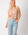 Take It From Here Floral Sleeveless Vest Top – Vintage Knit Style featuring a button-down front and soft floral pattern, styled with light wash jeans.
