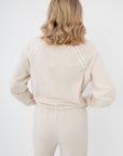 Back view of Z Supply Crystal All Around Sweatshirt showing pearl trim along raglan sleeves, soft cream fabric with relaxed silhouette.