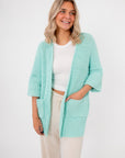 Mint Sorbet Chenille Slouch Cardigan in soft knit with front pockets and relaxed fit, ideal for cozy women's knitwear layering.