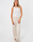 Lightweight Free People Clean Ivory Seamless Modal Tank styled with beige lounge pants, perfect for casual and breathable everyday wear.