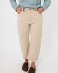 Free People Deep Trance Boyfriend Jean in casual khaki with relaxed mid-rise fit and cropped wide-leg cut, styled with hands in pockets.