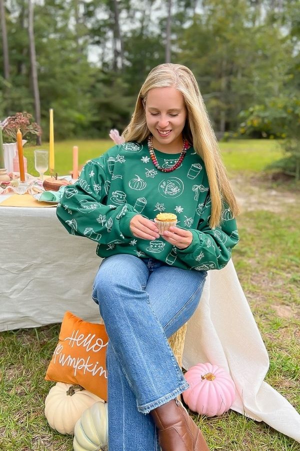 Pumpkin Pie Cutie Hunter Green Pullover Sweatshirt styled for fall with jeans and boots, perfect for cozy outdoor gatherings.