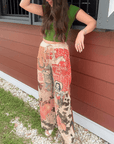 Ori Howdy Drawstring Pants in western print with elastic waist, styled with green top and cowboy hat for a rustic outdoor look.