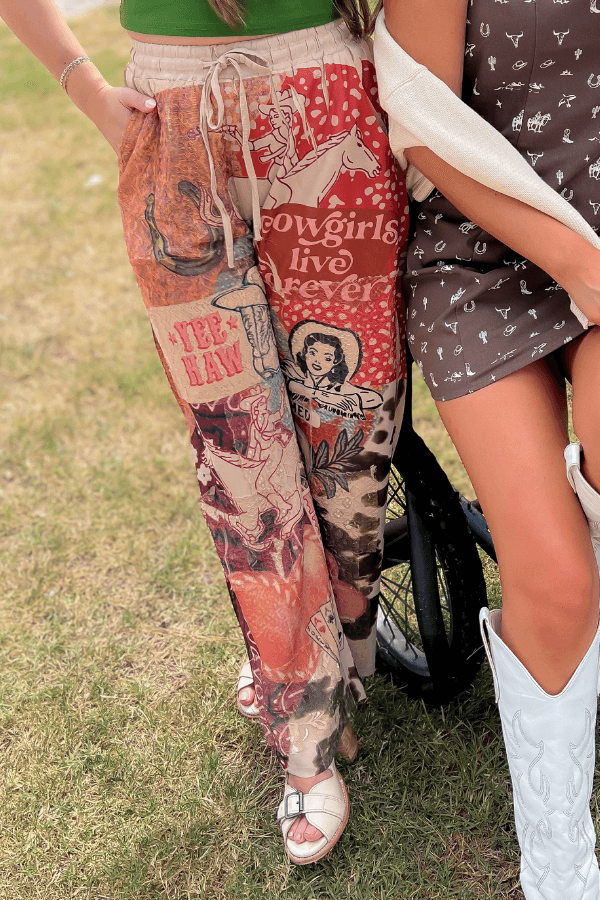 Ori Howdy Drawstring Pants styled with sandals and western accessories, highlighting cowgirl motifs and relaxed silhouette.