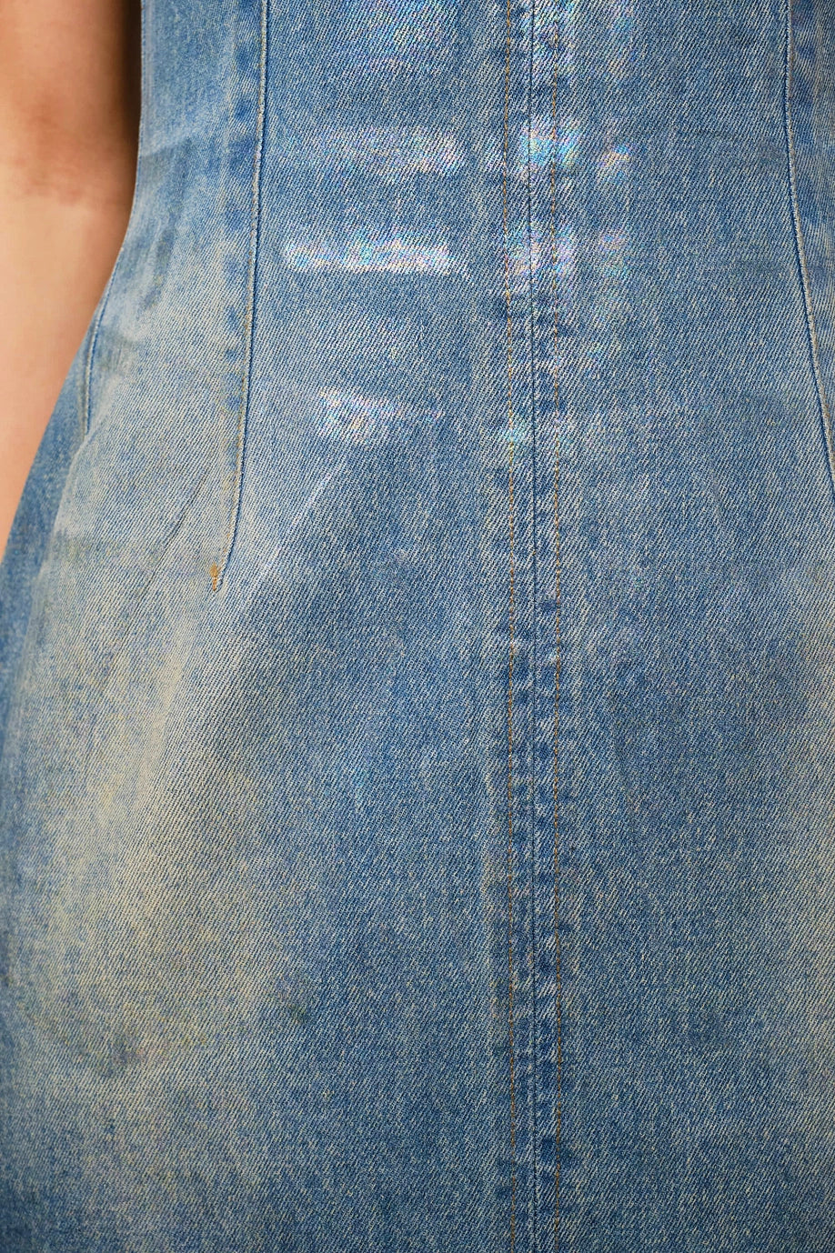 Close-up of denim fabric with iridescent shimmer, detailed view