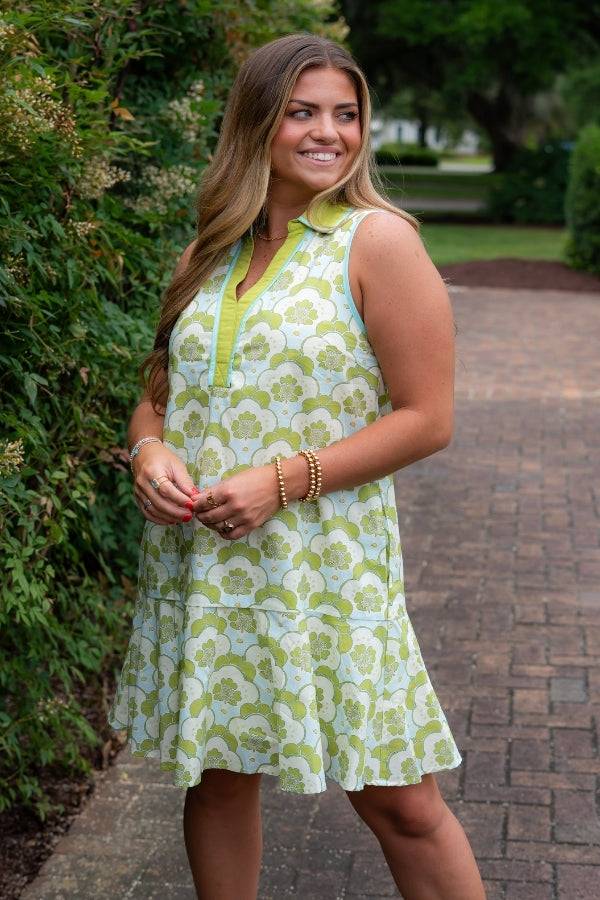 Sleeveless Emily Chartreuse Abstract Collared Dress featuring vibrant green floral patterns and a flared hem for a stylish, standout look.