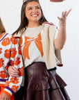 Goal Line Football Tee - Bone Bow Crop Tshirt styled for game day with maroon leather skirt and layered cardigan, perfect for sporty fashion fans.