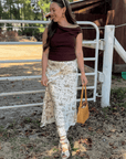 Friday Feeling Brown Asymmetrical Top worn with printed maxi skirt, ideal for stylish fall outfits and seasonal layering.