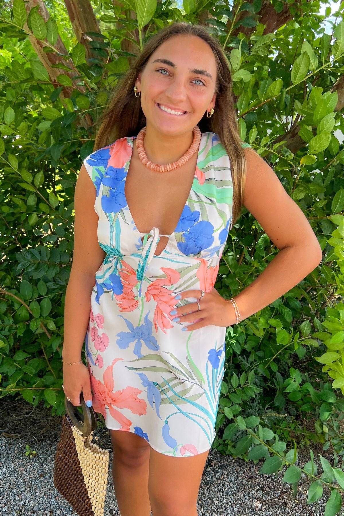 MINKPINK Floral Ravina Bias Mini Dress with bold floral design and sleeveless cut, styled for a chic and breezy summer look.